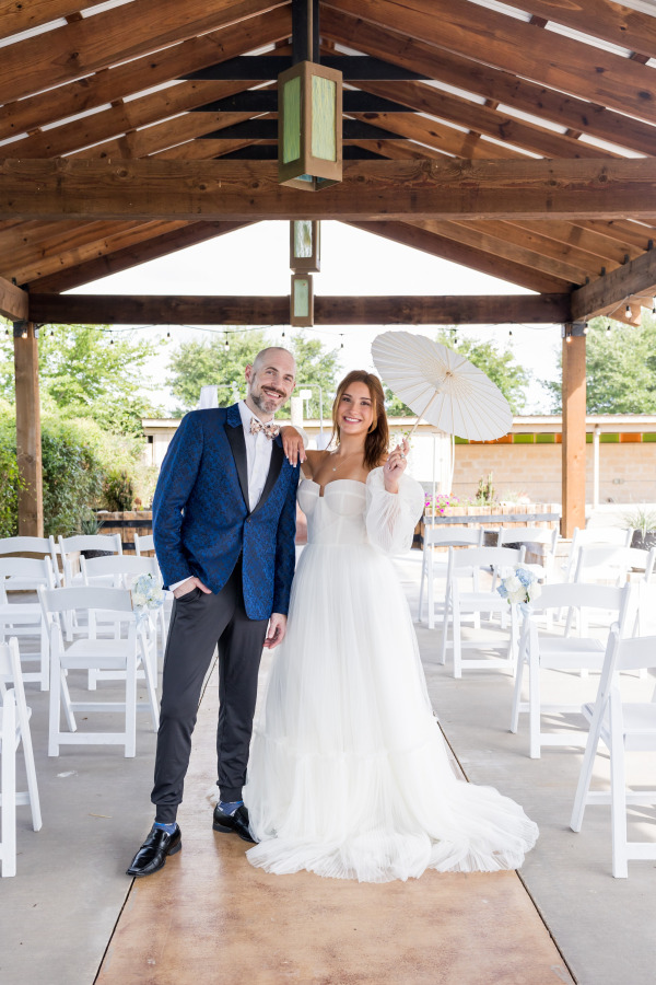 Bride and Groom posing next to each other