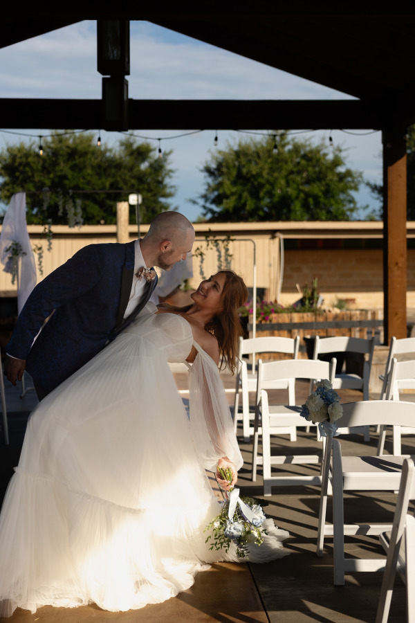 Groom holding his bride