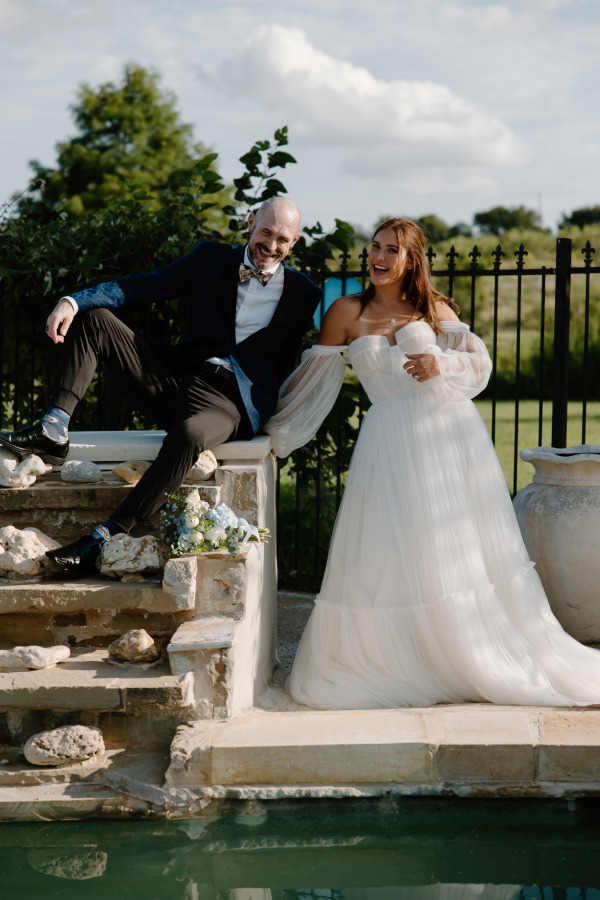 A groom and his bride smiling