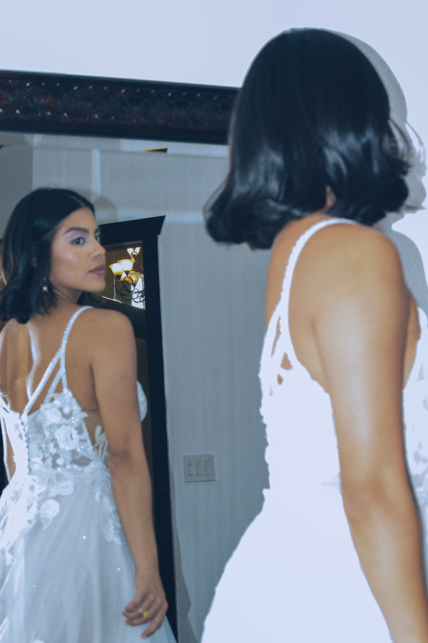 A bride looking at herself in the mirror