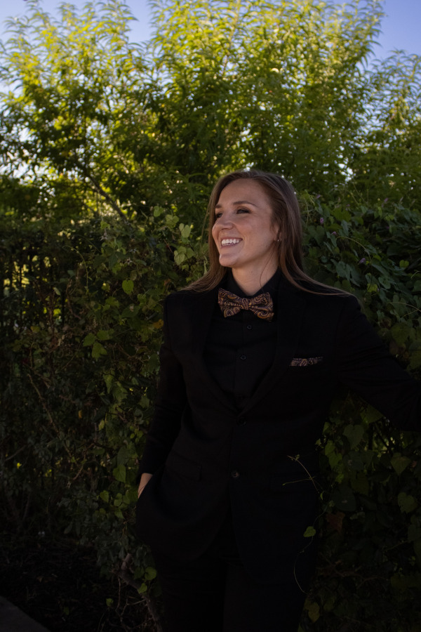 Woman smiles outside