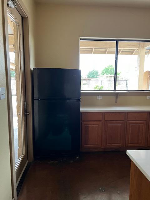 A kitchen with a refridgerator