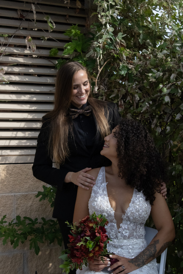 Two women smiling at each other