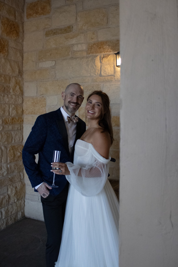 A bride and groom smiling away